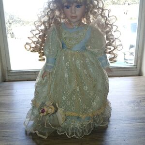 Elegant Blue and Gold Lace Doll